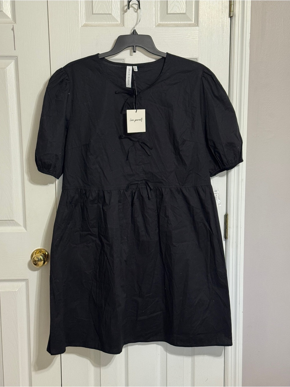 Grace + Karma Black Puff-Sleeve Cotton Mini Dress with Bow Tie detailing Front